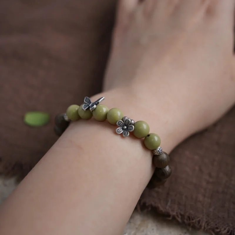 Vintage sandalwood bracelet with ethnic charm, perfect for women who love boho fashion
