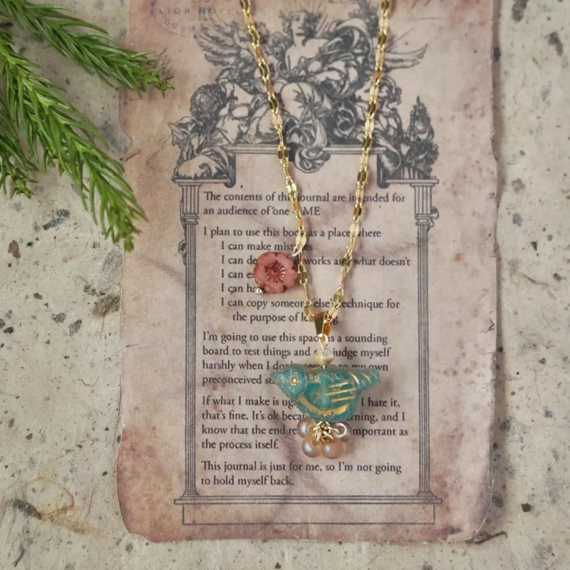Blue pendant necklace handcrafted by artisans, featuring delicate design and natural charm for everyday layering or meaningful gifting.