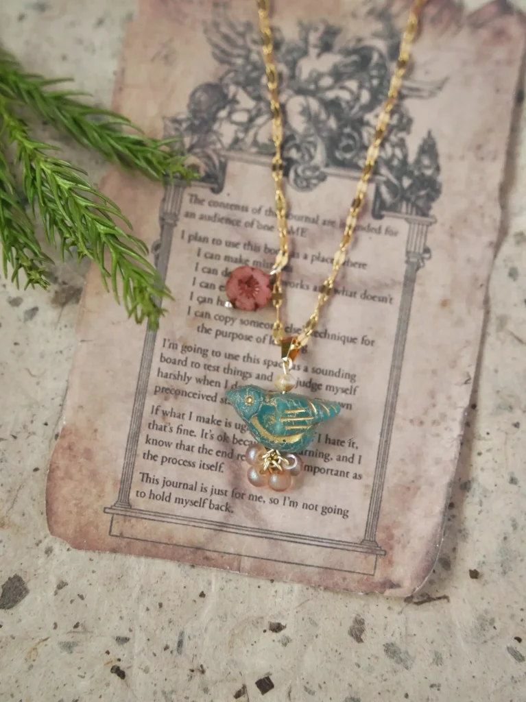 Blue bird necklace handcrafted with Czech glass beads, adding natural charm and elegant style for daily layering or gifting.