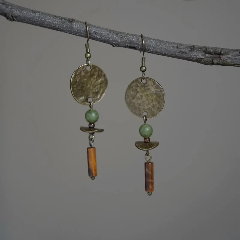 Boho-style brass earrings adorned with southern jade accents