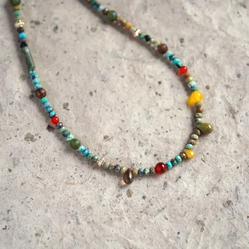This vintage necklace features Czech beads in dopamine hues, radiating playful energy.