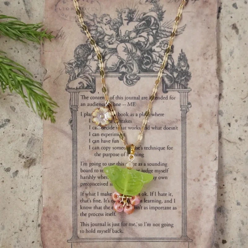 Green bird pendant necklace showcases natural elegance, handcrafted to bring subtle color and poetic charm to everyday layering