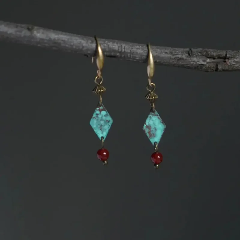 Boho green patina brass earrings, handcrafted for a unique vintage-inspired statement look.