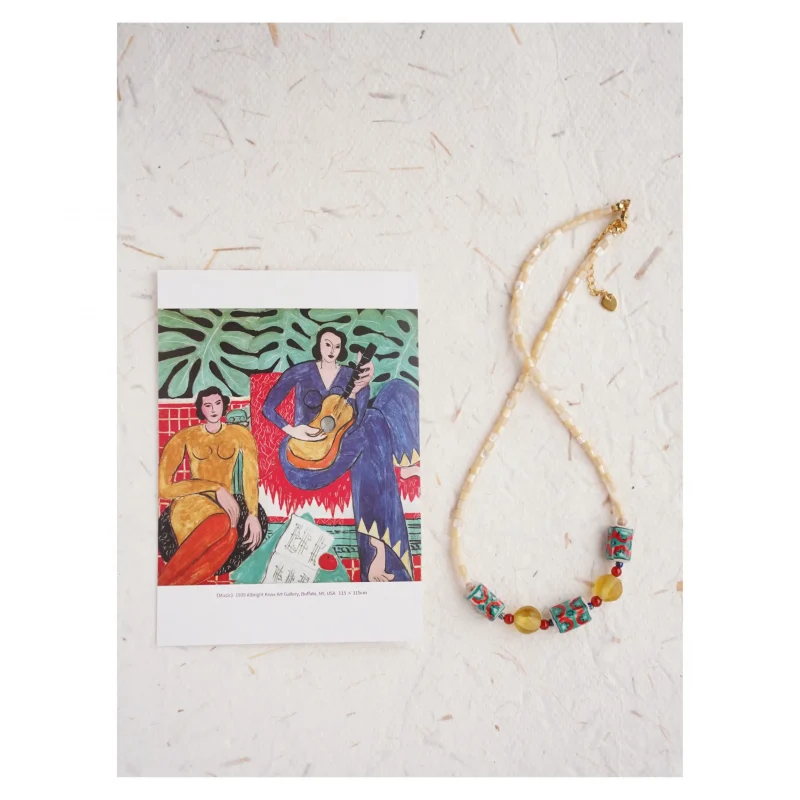 Handcrafted Matisse-style necklace captures bold shapes and expressive color in wearable art.