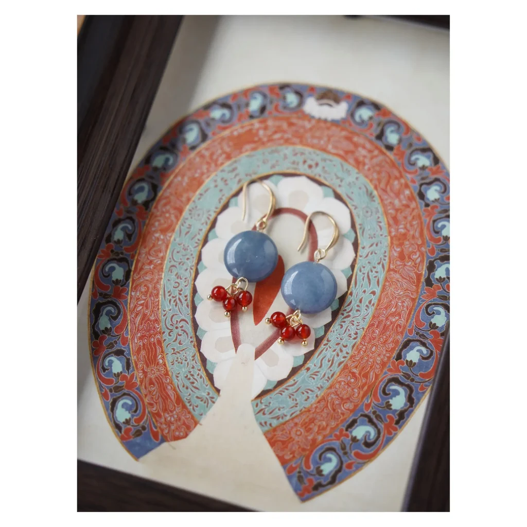Handcrafted agate and blue chalcedony earrings reflect vintage beauty while enhancing feminine elegance.