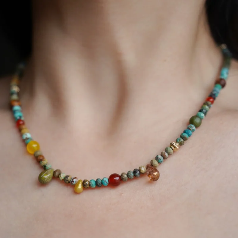 This handmade colorful necklace features natural turquoise beads, offering a vibrant touch to everyday women's style.