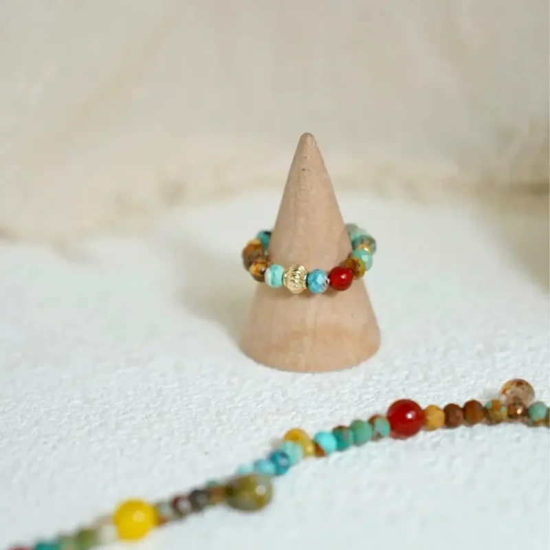Vintage-style handmade turquoise ring and bracelet set highlights artistic elegance and Boho charm.