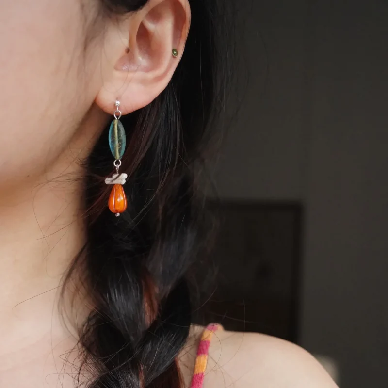 Model showcases handcrafted vintage 925 silver post earrings with Czech beads and silver posts, blending retro charm with elegance.