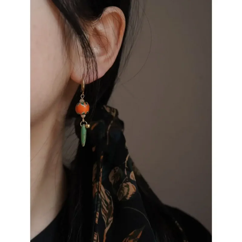 Model wears Peonyjewels’ original vintage glass bead earrings, showcasing bold texture and artistic flair.