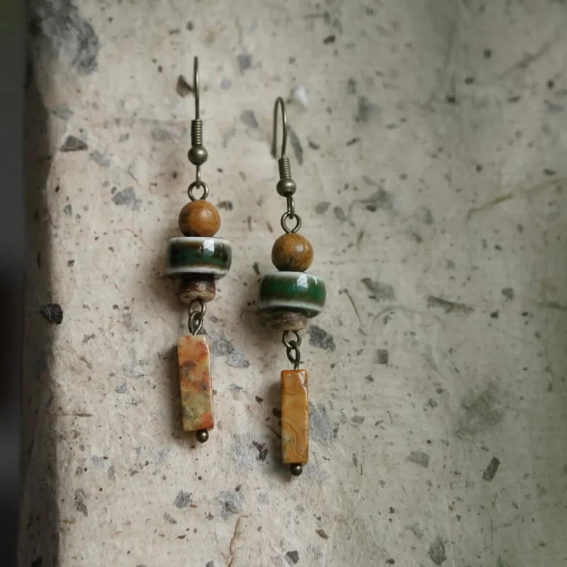 Gold-plated silver hook earrings feature personalized artisan design for a unique fashion statement