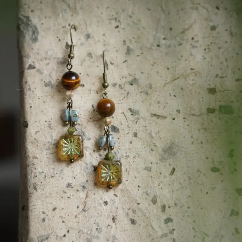 Vintage tiger’s eye dangle earrings designed for confident 25-year-old women with elegant retro charm