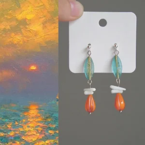 Vintage handmade earrings with Czech beads capture the warm hues of a seaside sunset.