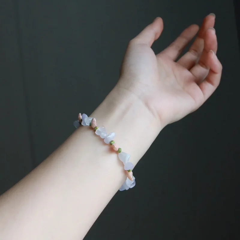 Hand shows off vintage handmade crystal bracelet, highlighting its textured design and artisan details for thoughtful gifting.