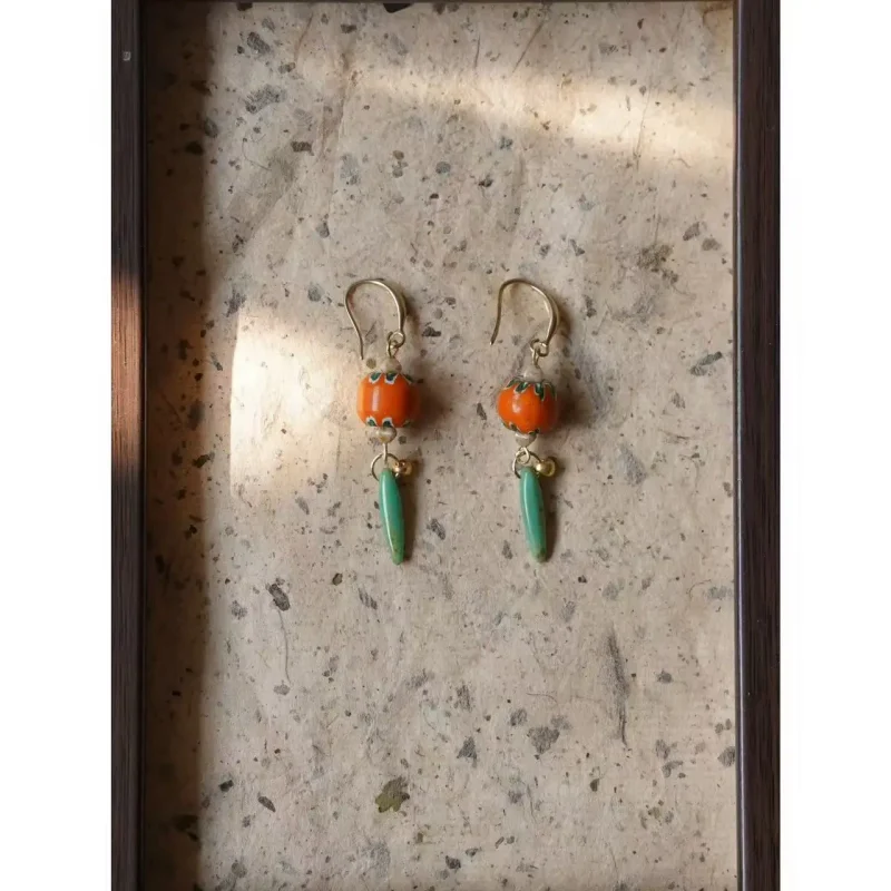Handmade vintage earrings use antique orange glass beads for a unique and original jewelry design.