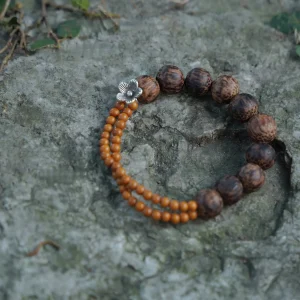 Handmade coconut wood bracelet features natural olive pit beads for an earthy, organic style