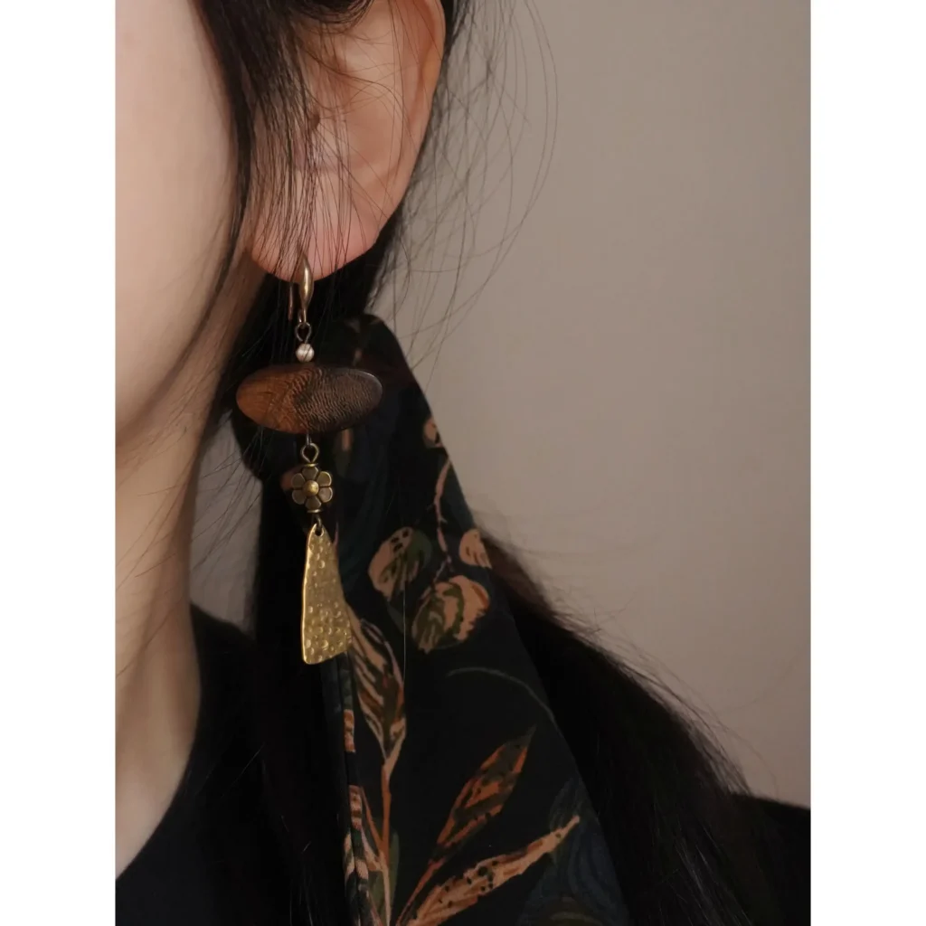 Model wearing handmade original vintage earrings.