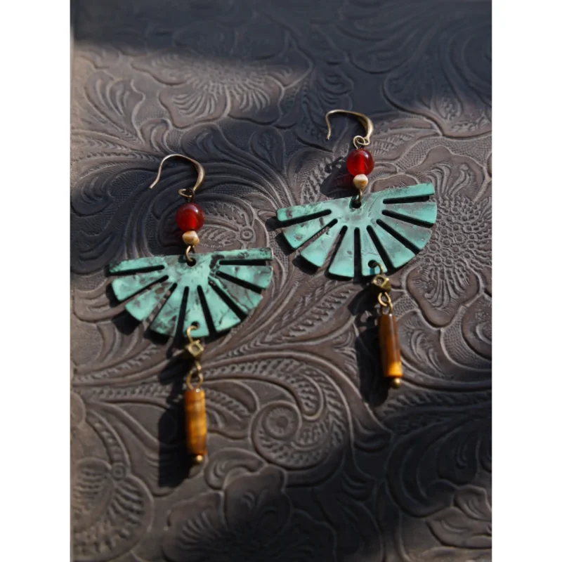 Handcrafted earrings paired with tiger's eye stones create a unique accent for daily wear.