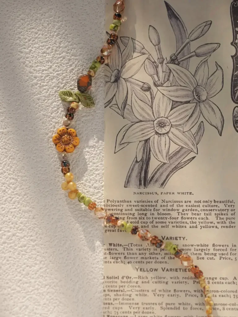 Handmade colorful necklace uses vintage Czech beads to create a unique accessory for holidays and getaways