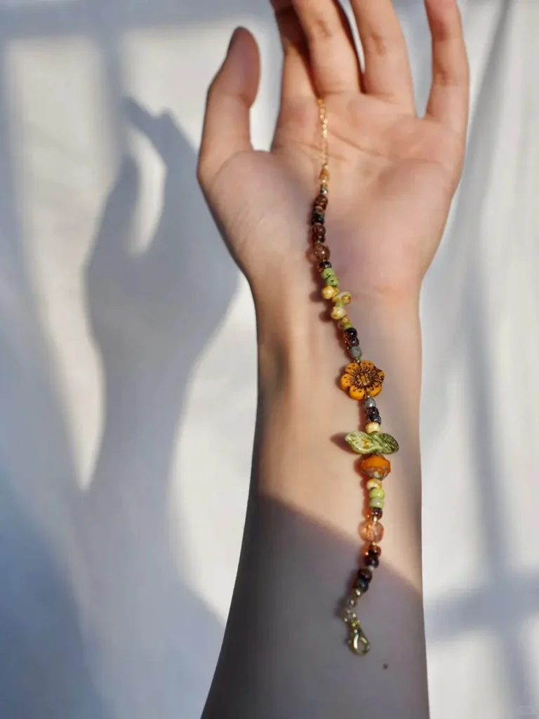 Handmade beaded bracelet uses natural Czech glass to reflect botanical elegance and earthy charm
