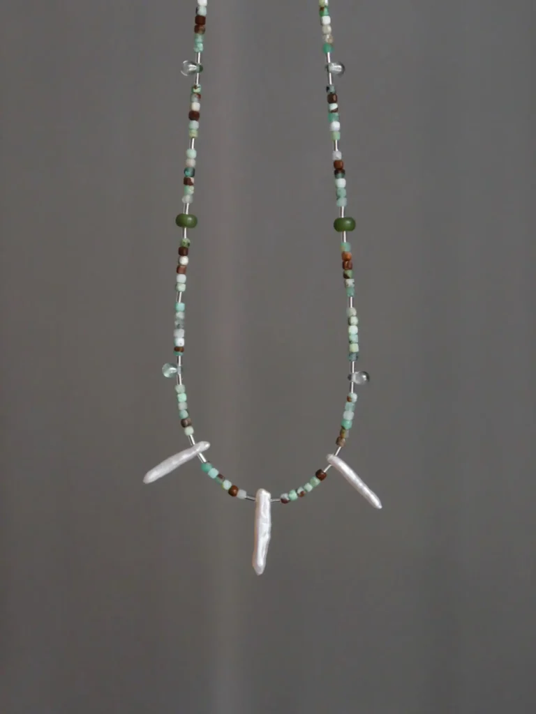Handcrafted jade beaded necklace pairs with freshwater pearls in an original design for a refined vintage look