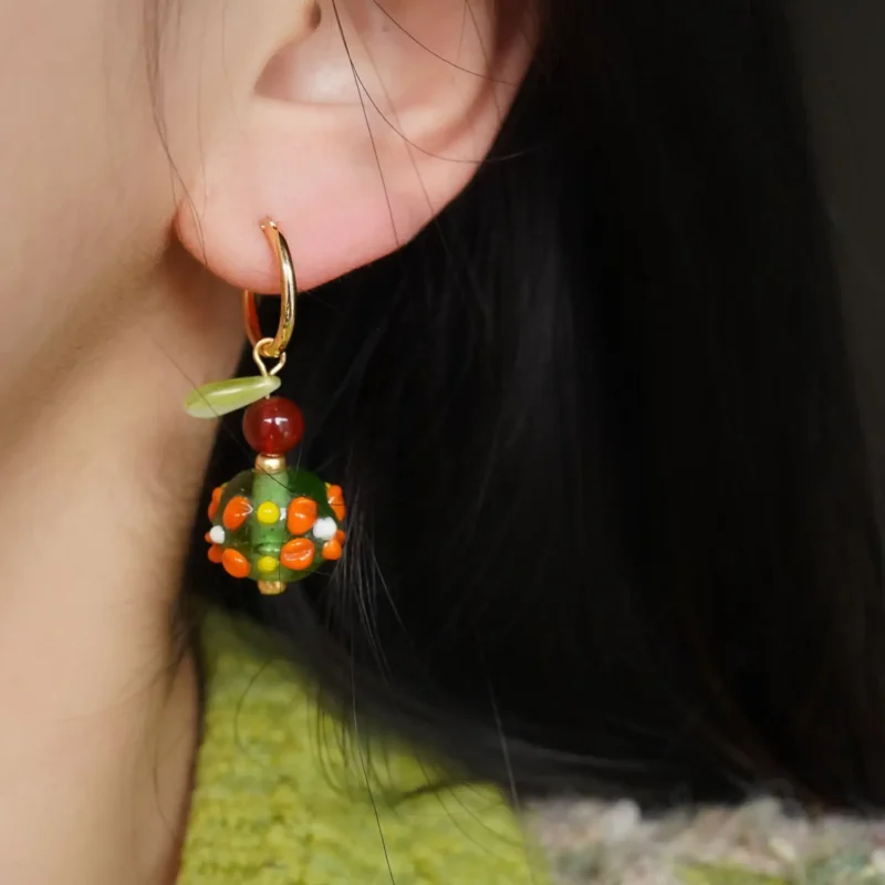 Model wearing handmade vintage beaded jewelry, expressing natural texture and retro elegance