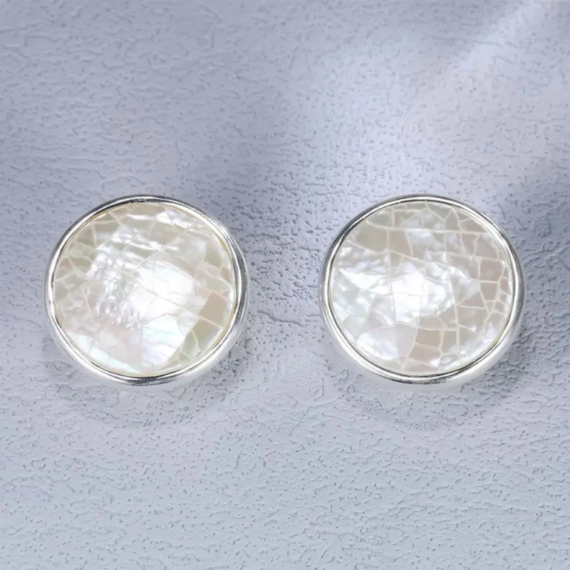 Silver stud earrings exude understated luxury with minimalist round design