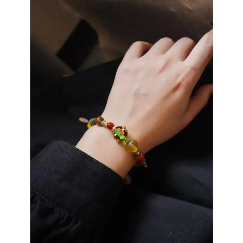 Model showcases handcrafted vintage gemstone jewelry, blending timeless elegance with artisan detail