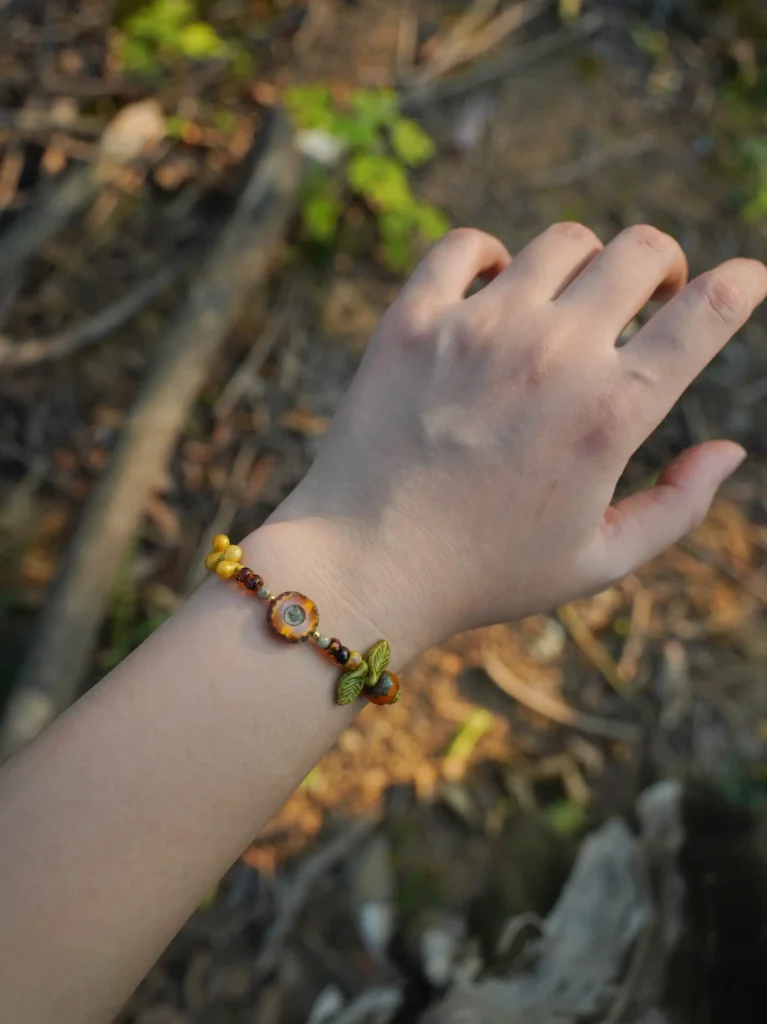 Model wears handmade jewelry to express vintage beauty and natural elegance