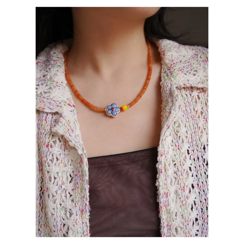Model wears red aventurine paired with natural agate, showcasing vintage natural charm