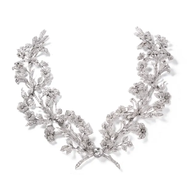 Rococo-style diamond jewelry, featuring intricate swirling floral patterns and elegant ribbon-like designs, characteristic of the Edwardian era.
