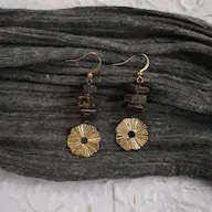 MuZhi  earrings in 925 silver and coconut wood, worn by model