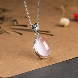 Pink crystal pendant necklace on a minimalist 925 silver chain, radiating modern elegance.
