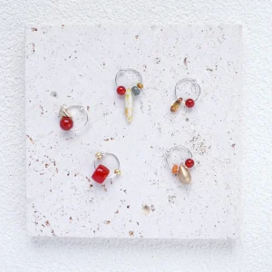 silver hoop earrings with red agate, a delicate and eye-catching everyday accessory.
