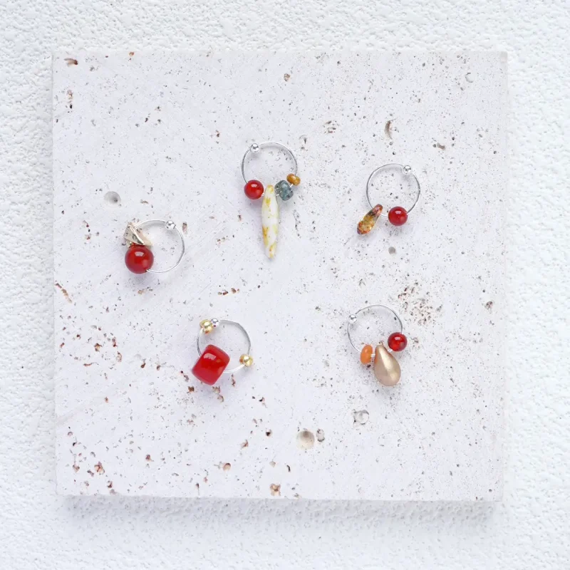 silver hoop earrings with red agate, a delicate and eye-catching everyday accessory.