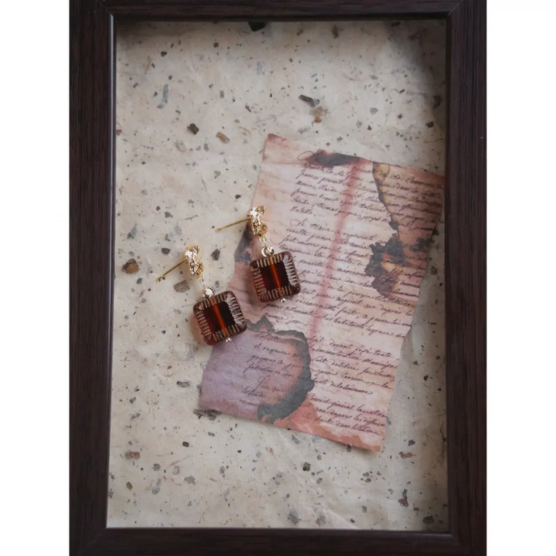 Gold-plated silver posts showcase vintage glass in these elegant handmade earrings for women.