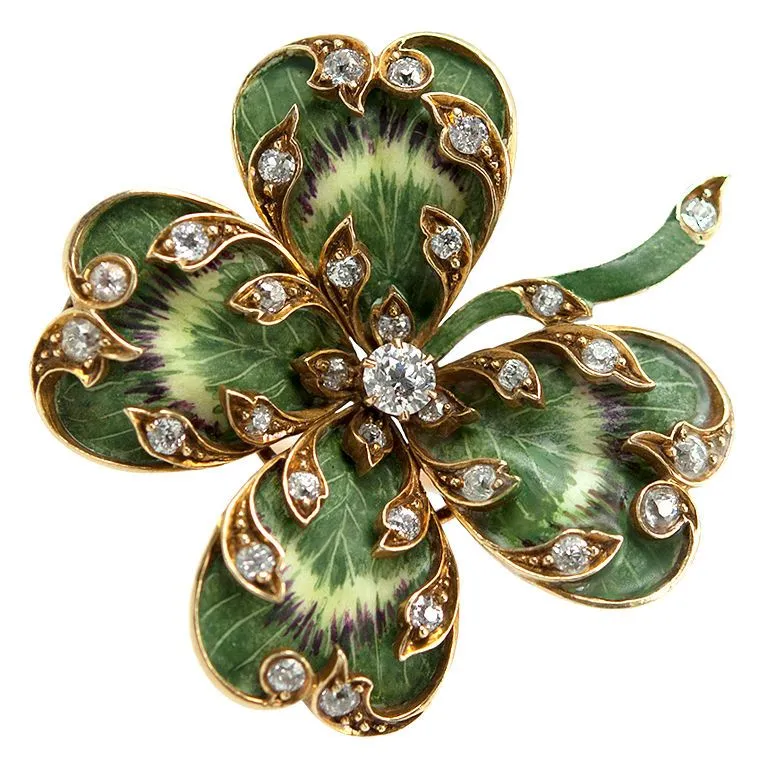Vintage handcrafted gold ring featuring a four-leaf clover design with diamonds, symbolizing luck and protection.