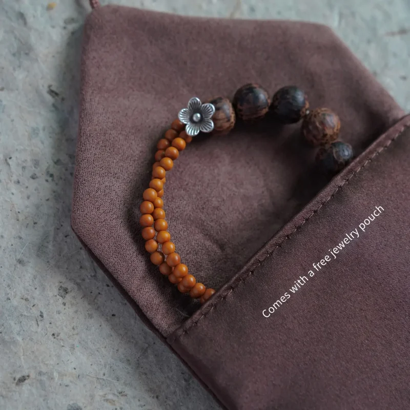 Coconut wood bracelet for women features handmade Thai silver accents and includes a pouch for daily care