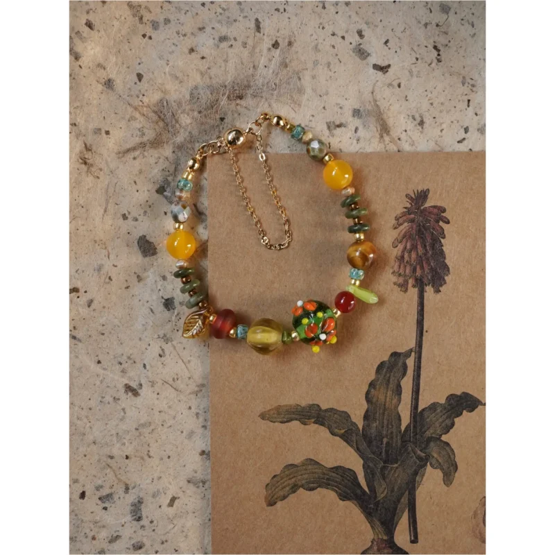 Vibrant handmade bracelet with natural beads and Nepalese glass, designed to uplift your mood
