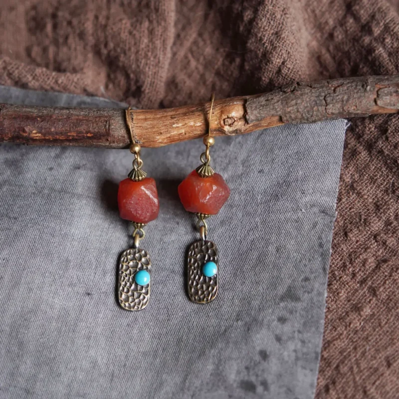 Brass pendant earrings featuring faceted eight-sided agate, perfect for versatile daily wear across seasons.