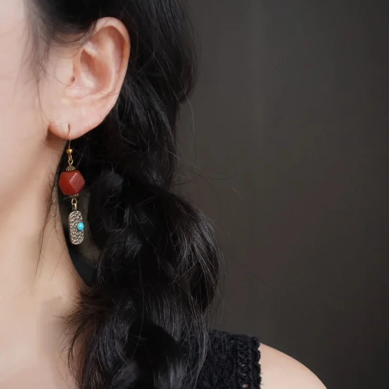 Hammered brass earrings displayed on the ear, highlighting texture and versatile daily wear for women.
