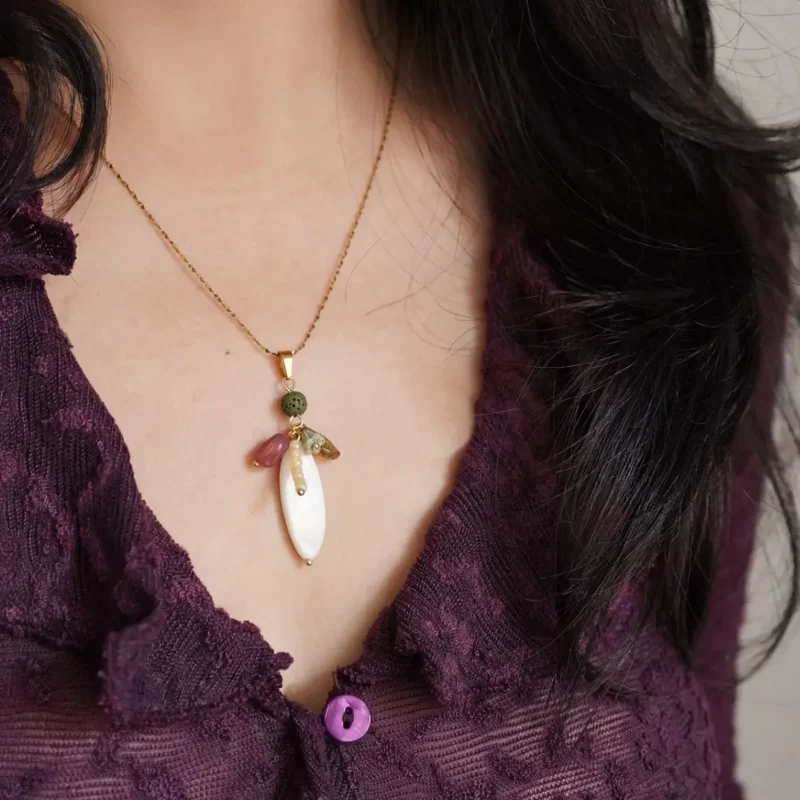 Handmade long necklace complements V-neck outfits, adding elegance and effortless style for everyday wear.