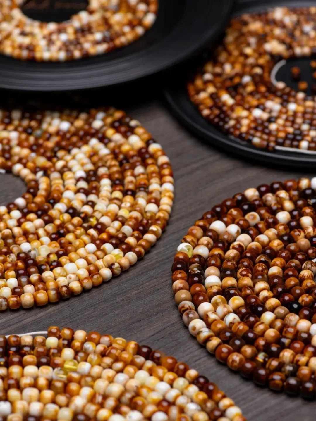 Close-up of sunstone beads on handmade vintage earrings