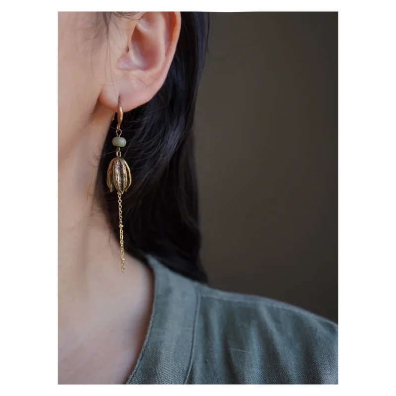 Handmade vintage silver earrings showcased by model, highlighting elegant charm and adding timeless style to women’s daily outfits.