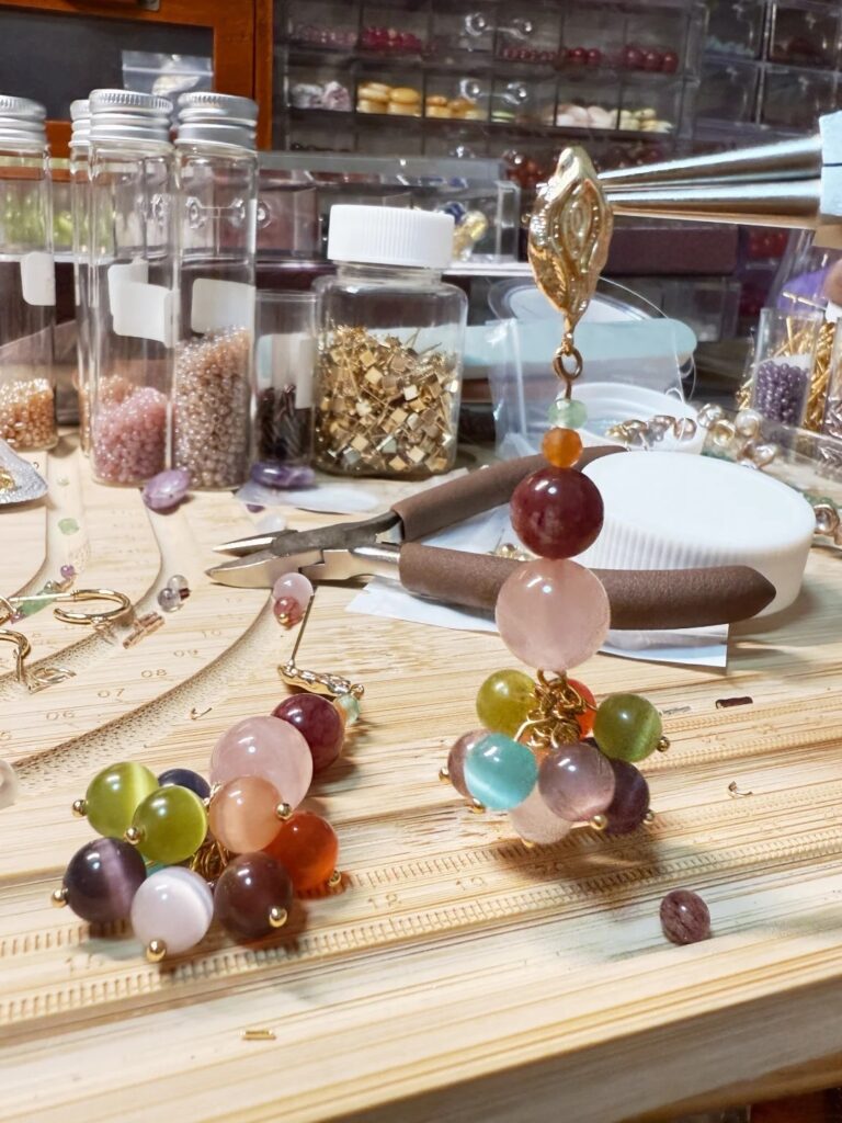 PeonyJewels designer sketching and crafting handmade jewelry in the studio