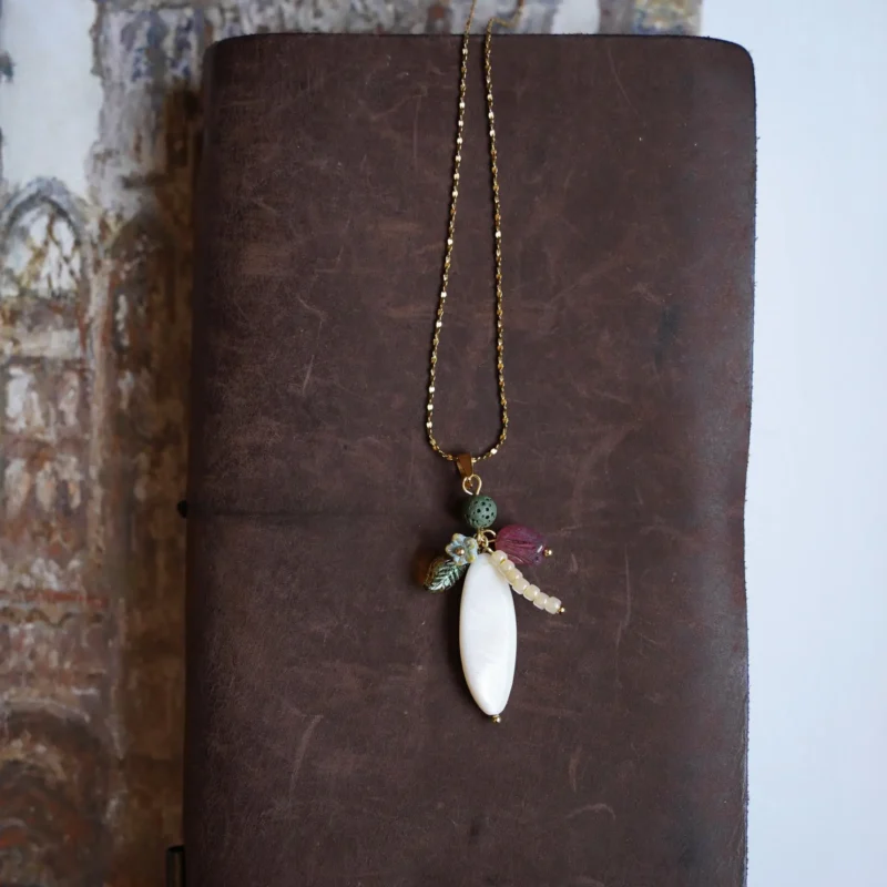 Durable steel-titanium chain necklace features a pendant, allowing women to layer effortlessly for everyday modern style.