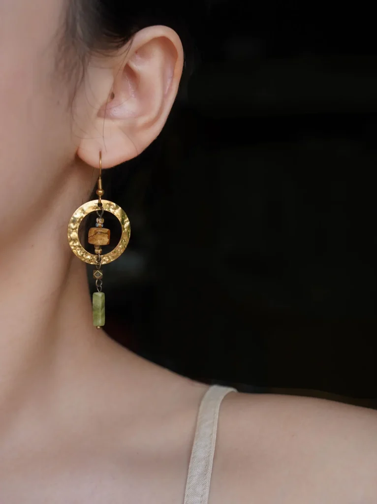 Lifestyle image of women’s pendant earrings, highlighting their elegant design and everyday wear appeal.