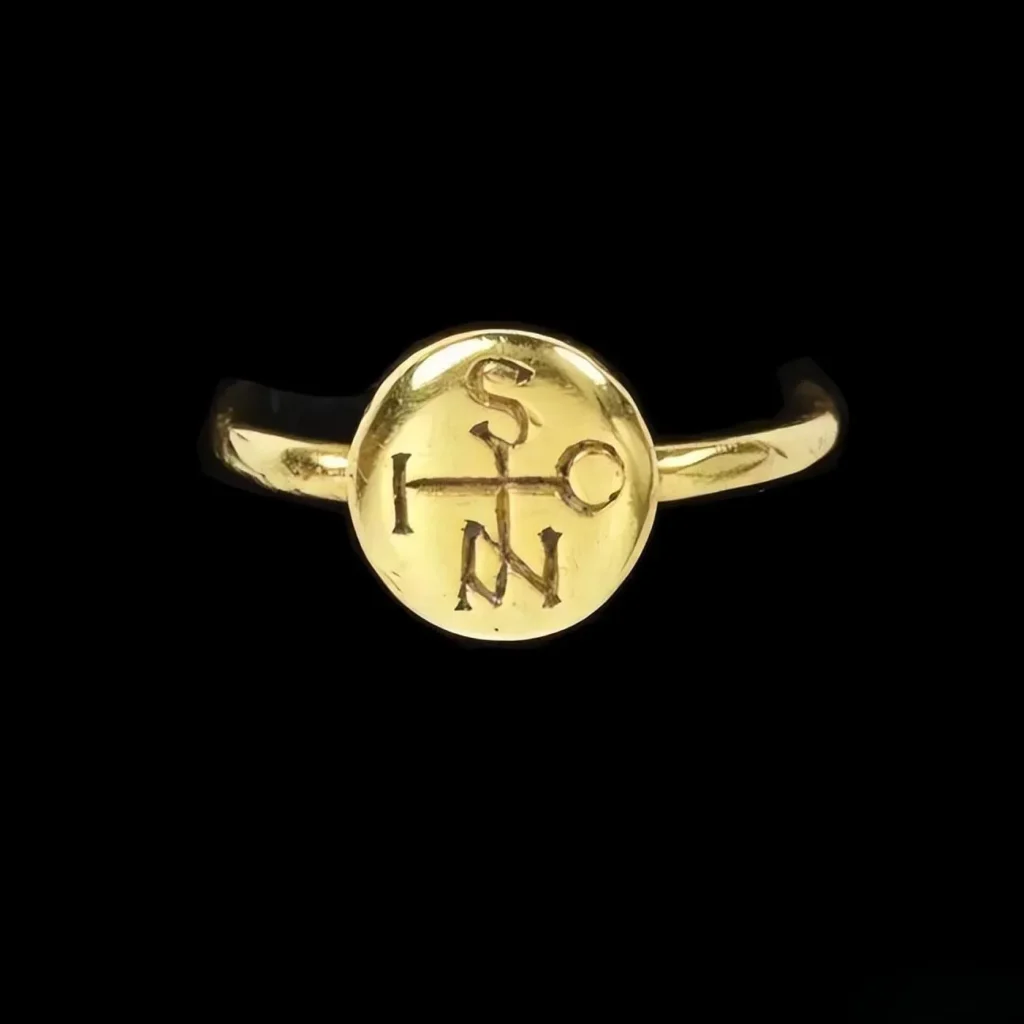 A vintage handmade ring featuring a monogram pattern, with interwoven letters forming a unique personal symbol inspired by Western decorative motifs, similar to logos used by LV, YSL, and CHANEL.
