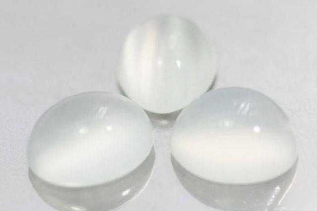 Moonstone gemstone, widely sourced but high-quality specimens with clear blue adularescence are rare and valuable.