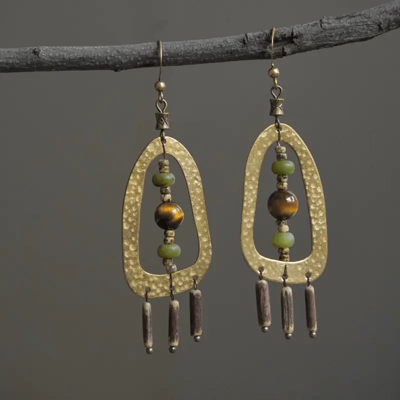 Handmade hammered brass earrings by Peonyjewels, featuring tiger eye stones with unique textured finish
