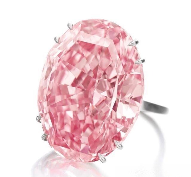 The 59.6-carat Pink Star diamond ring sold at auction for 5.53 billion HKD to Chow Tai Fook, showing a vivid fancy pink diamond.